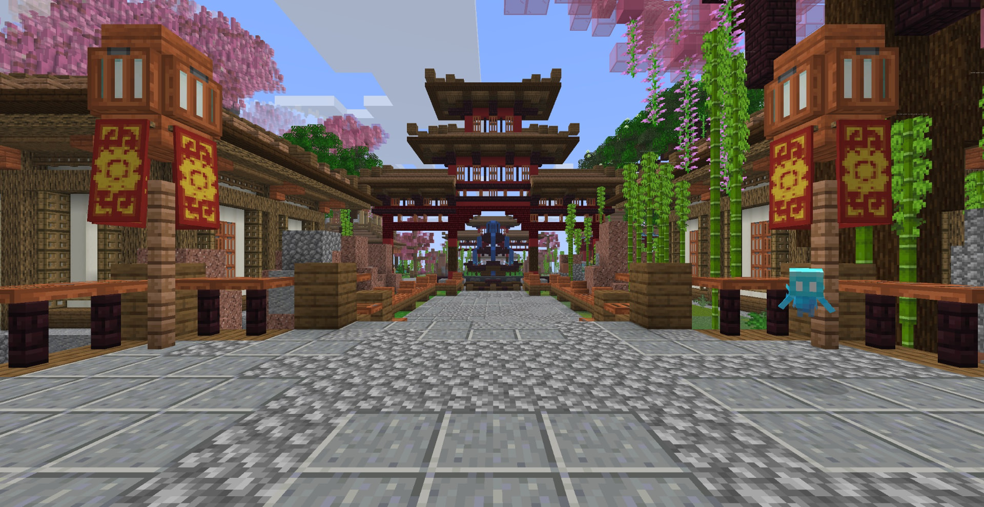 Blossom Village spawn at PetalMC, a lantern-lit street leading to a pagoda gate and fountain